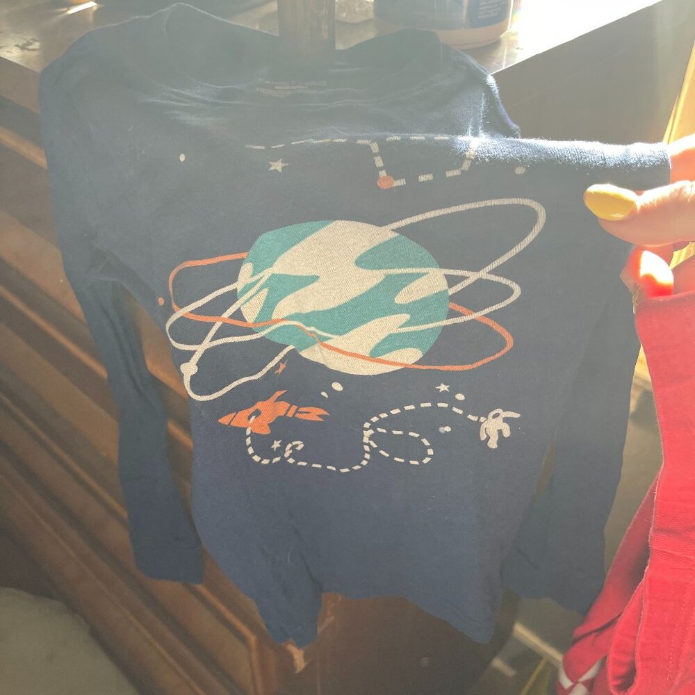 child's navy blue long-sleeved shirt or pajama top